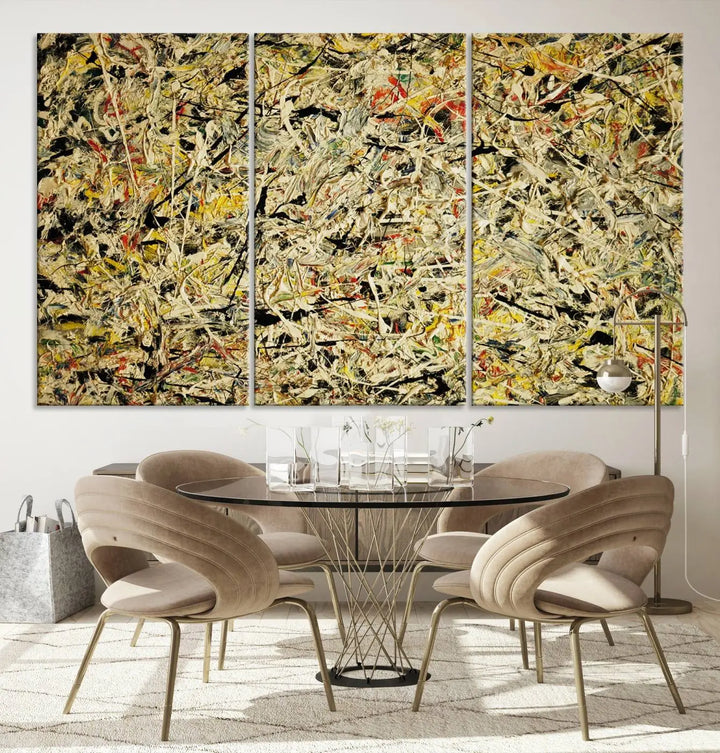 A Jackson Pollock Yellow Abstract Wall Art Canvas Print, featuring chaotic splashes of black, yellow, and red on a museum-quality canvas, is displayed prominently.