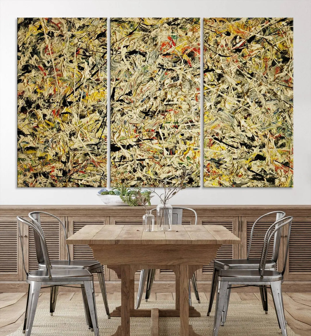 A Jackson Pollock Yellow Abstract Wall Art Canvas Print, featuring chaotic splashes of black, yellow, and red on a museum-quality canvas, is displayed prominently.