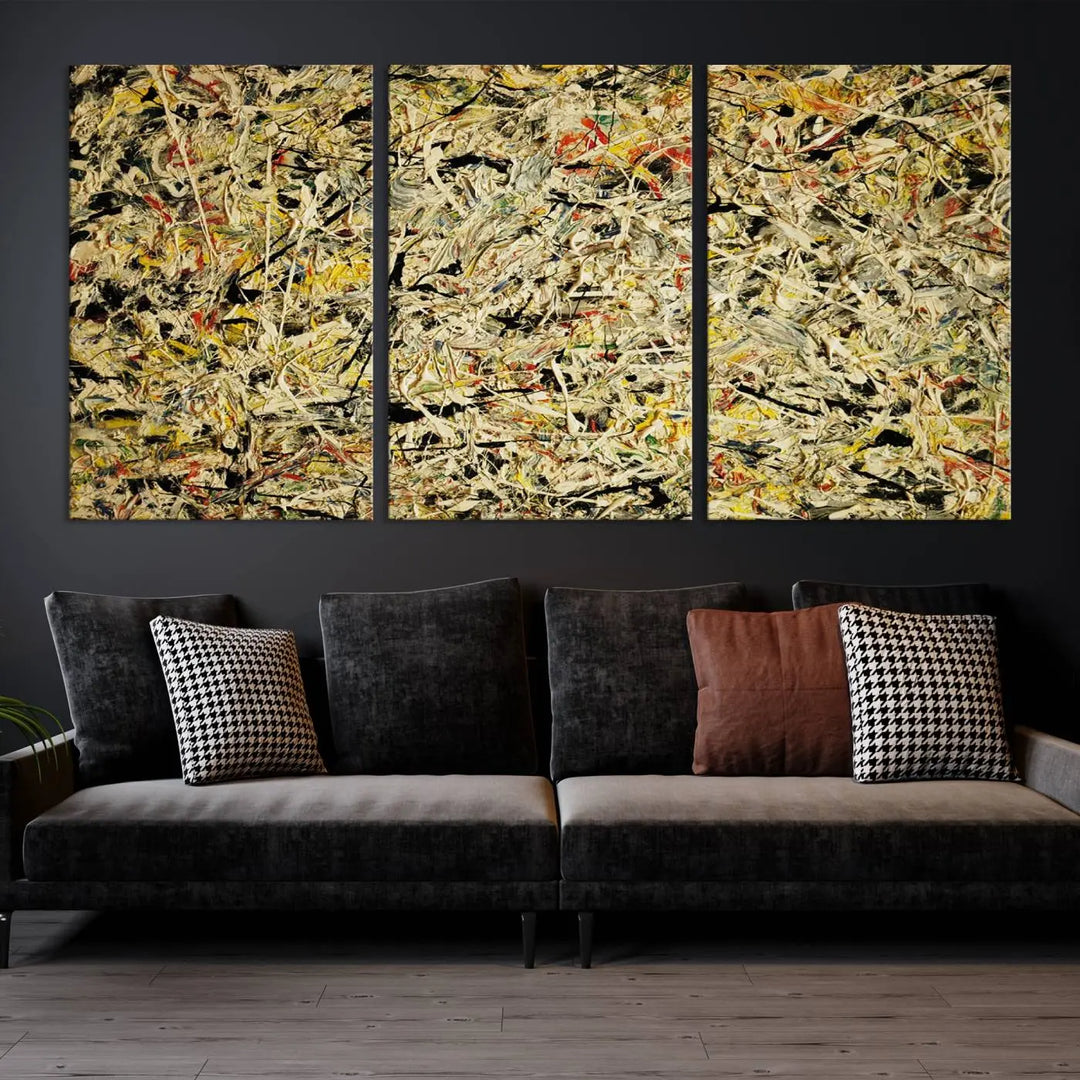 A Jackson Pollock Yellow Abstract Wall Art Canvas Print, featuring chaotic splashes of black, yellow, and red on a museum-quality canvas, is displayed prominently.