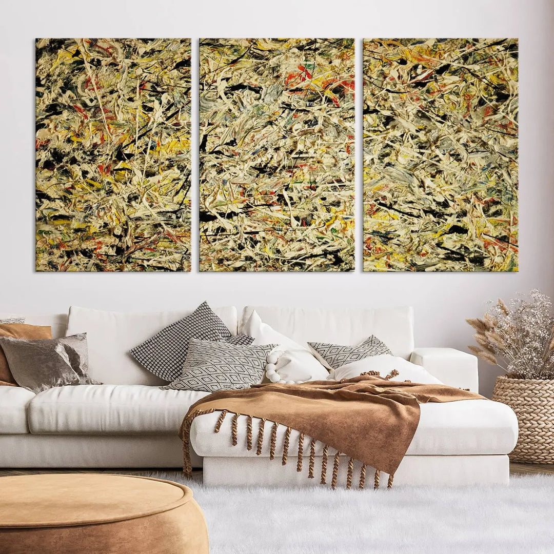 A Jackson Pollock Yellow Abstract Wall Art Canvas Print, featuring chaotic splashes of black, yellow, and red on a museum-quality canvas, is displayed prominently.