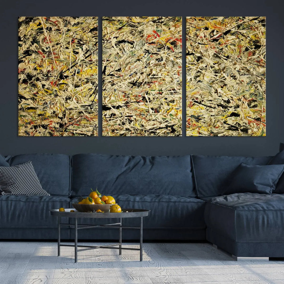 A Jackson Pollock Yellow Abstract Wall Art Canvas Print, featuring chaotic splashes of black, yellow, and red on a museum-quality canvas, is displayed prominently.