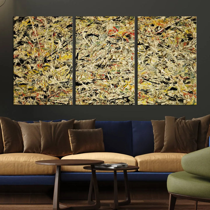 A Jackson Pollock Yellow Abstract Wall Art Canvas Print, featuring chaotic splashes of black, yellow, and red on a museum-quality canvas, is displayed prominently.