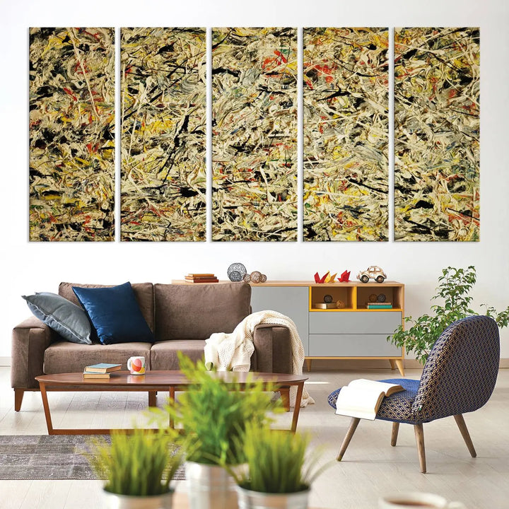 A Jackson Pollock Yellow Abstract Wall Art Canvas Print, featuring chaotic splashes of black, yellow, and red on a museum-quality canvas, is displayed prominently.