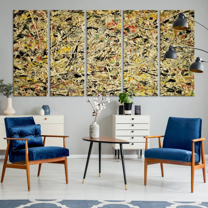 A Jackson Pollock Yellow Abstract Wall Art Canvas Print, featuring chaotic splashes of black, yellow, and red on a museum-quality canvas, is displayed prominently.