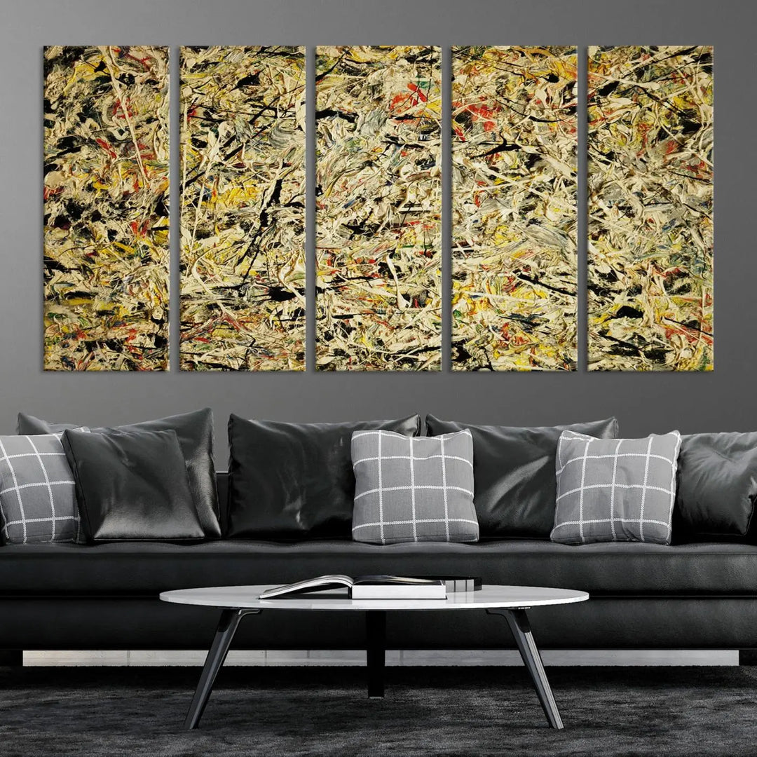 A Jackson Pollock Yellow Abstract Wall Art Canvas Print, featuring chaotic splashes of black, yellow, and red on a museum-quality canvas, is displayed prominently.