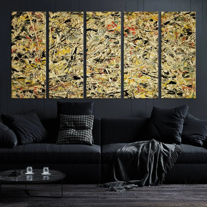 A Jackson Pollock Yellow Abstract Wall Art Canvas Print, featuring chaotic splashes of black, yellow, and red on a museum-quality canvas, is displayed prominently.