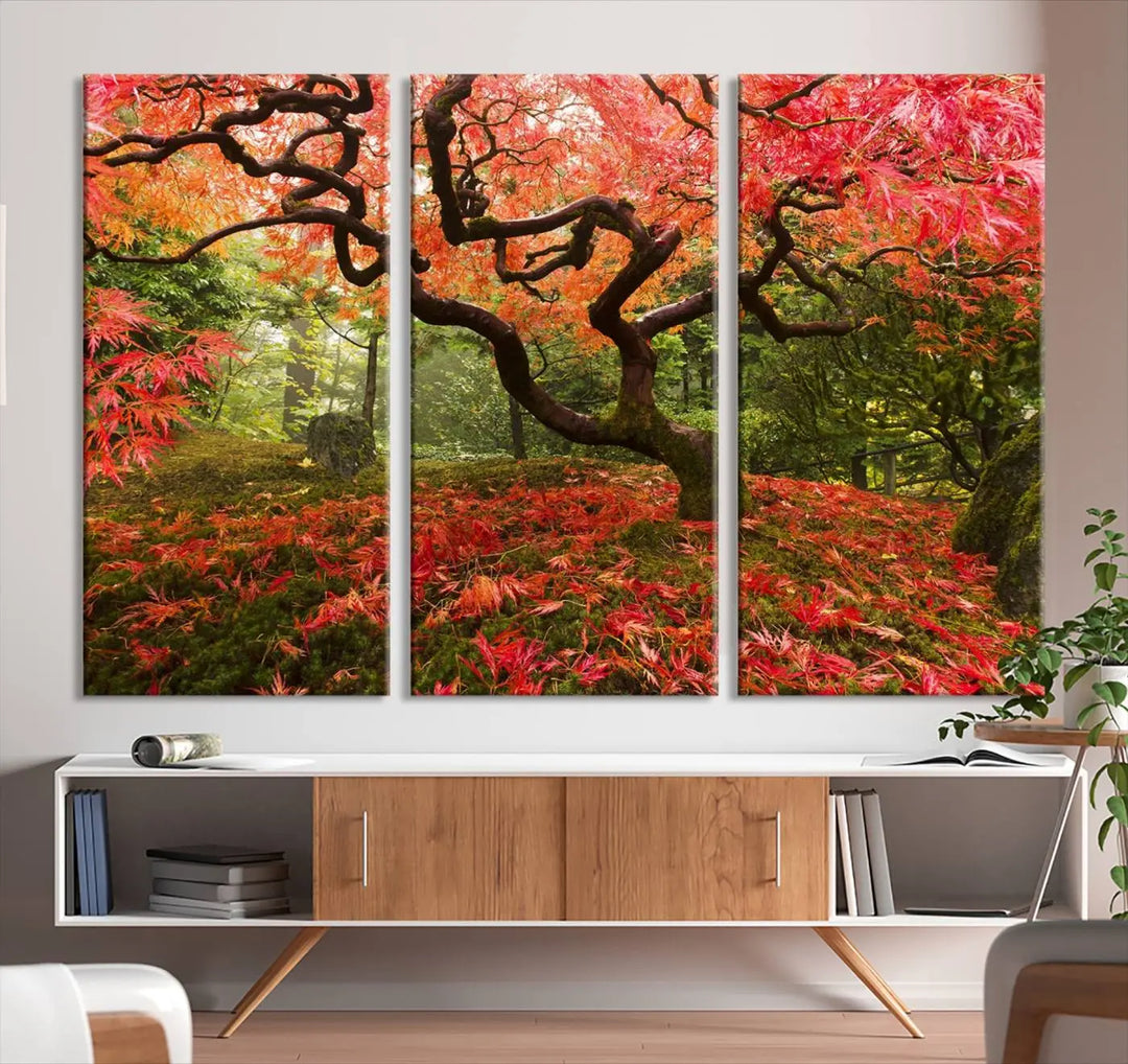 A modern living room features a triptych of the "Japanese Maple in Autumn Japanese Garden Portland Oregon Wall Art Canvas Print," elegantly displayed on museum-quality canvas.