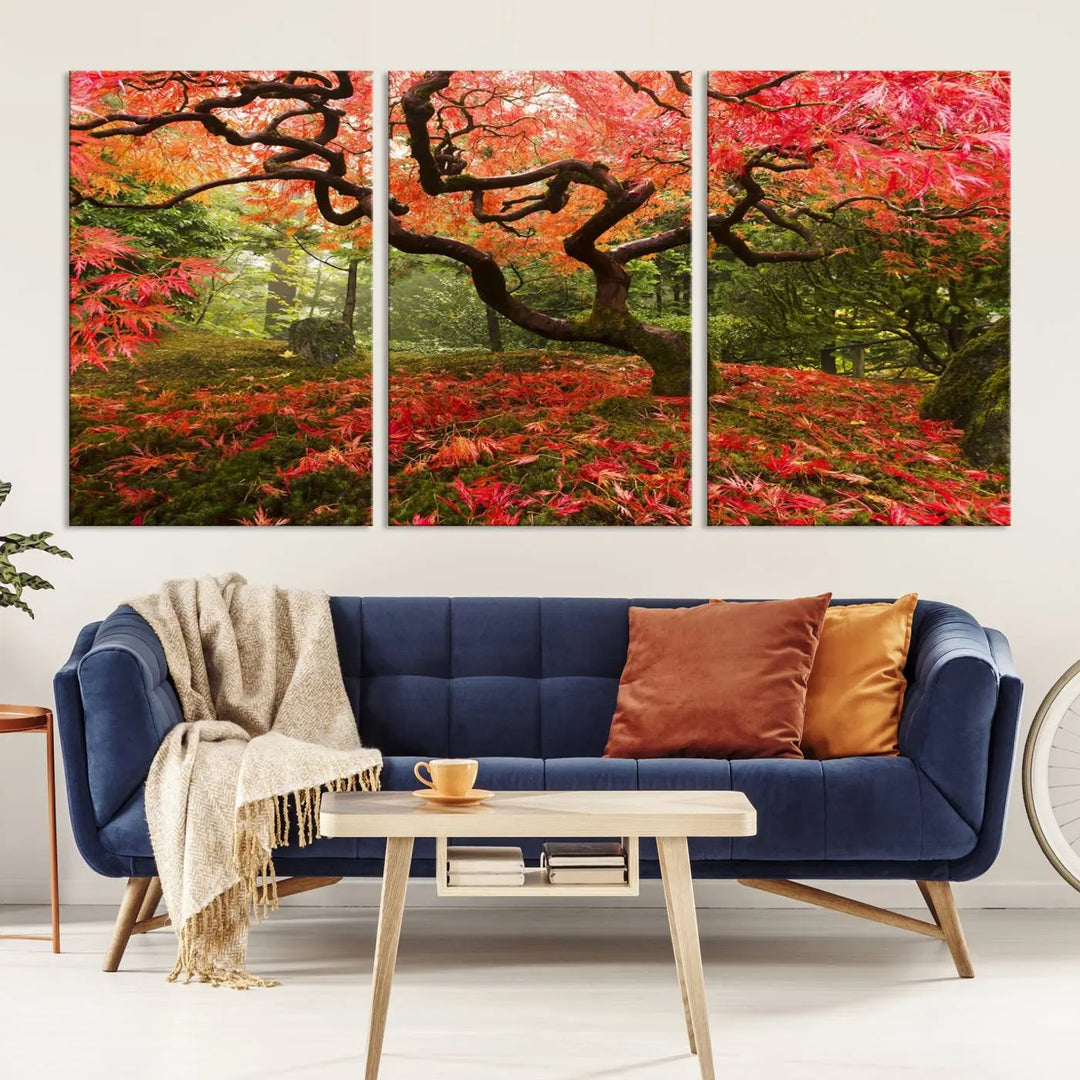 A modern living room features a triptych of the "Japanese Maple in Autumn Japanese Garden Portland Oregon Wall Art Canvas Print," elegantly displayed on museum-quality canvas.