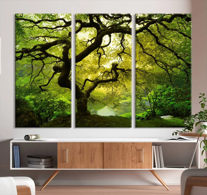 The triptych artwork titled "Japanese Maple in Japanese Garden, Portland Oregon" features lush green foliage and is crafted on museum-quality canvas, ready to hang in a well-lit room.