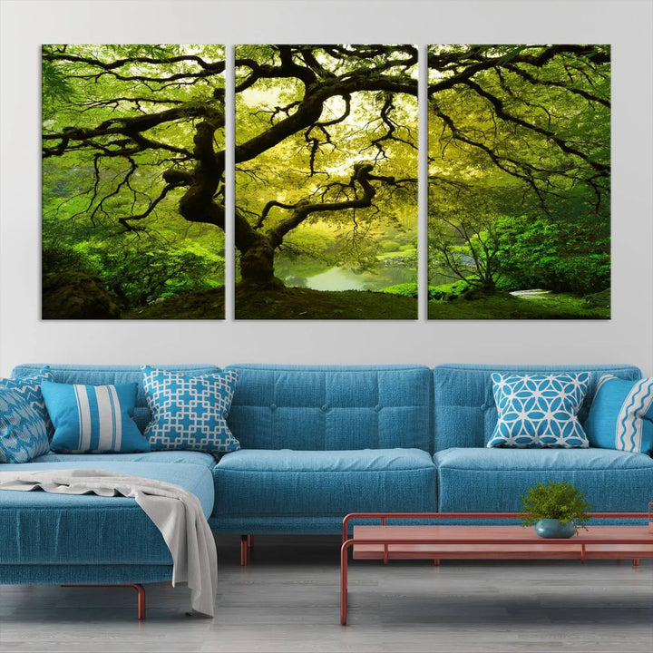 The triptych artwork titled "Japanese Maple in Japanese Garden, Portland Oregon" features lush green foliage and is crafted on museum-quality canvas, ready to hang in a well-lit room.