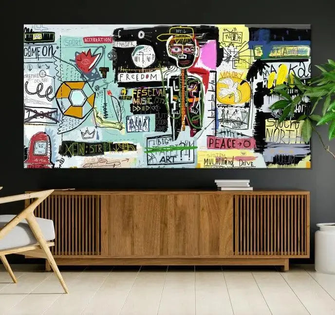 The Jean Abstract Graffiti Canvas, a modern abstract wall art inspired by street art and featuring vibrant symbols and text, is elegantly displayed in the living room.