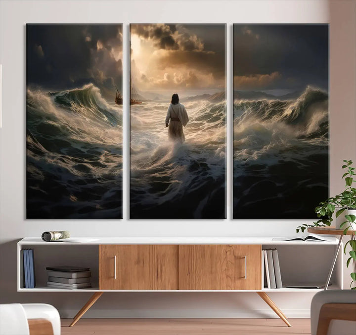 The Jesus Walking on Water Wall Art Canvas Print, a triptych mural featuring Jesus traversing turbulent waves with a distant boat under a dramatic sky, embodies spiritual art and religious decor. It inspires reflection and tranquility in the space.