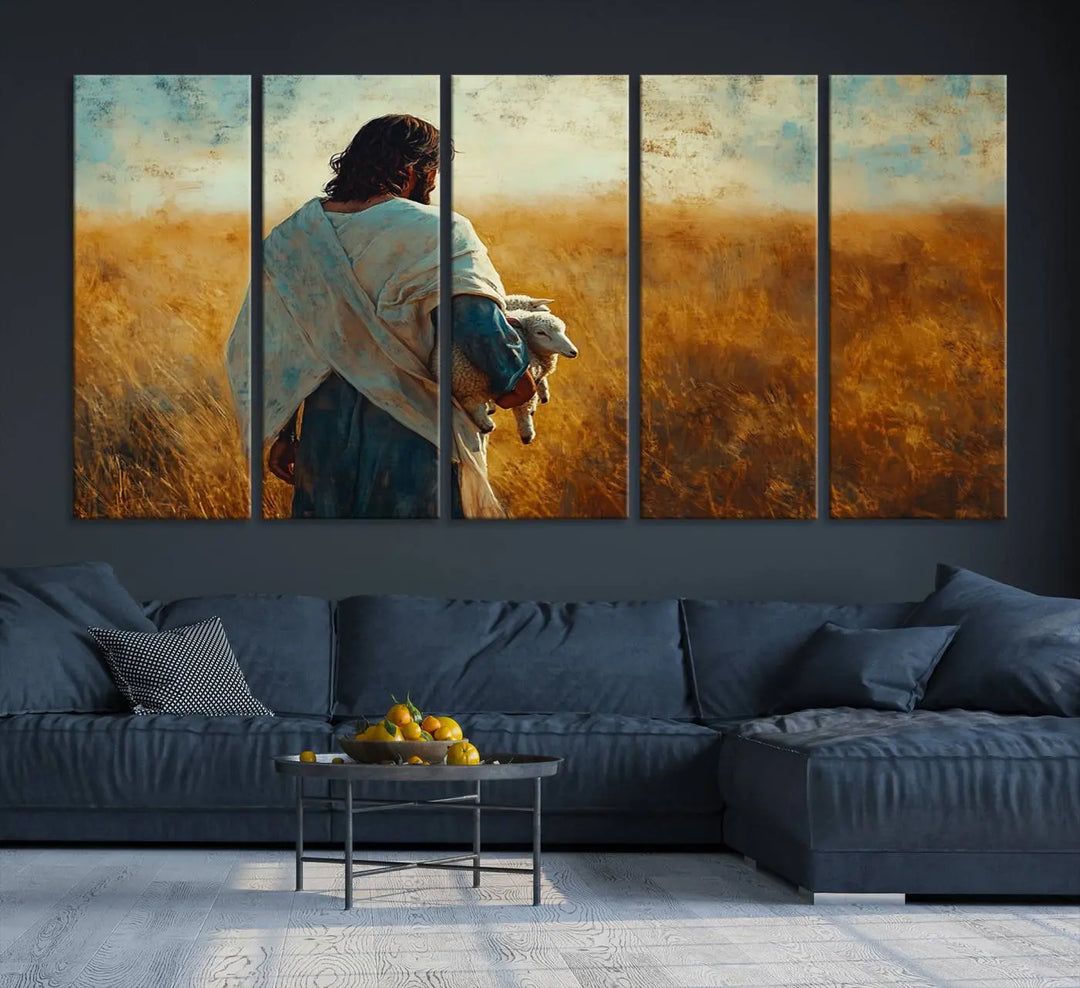 The Jesus the Good Shepherd Wall Art Canvas Print, featuring a figure in a robe holding a lamb amidst a golden field at sunset, adds serene beauty to the wall and embodies inspirational Christian decor.