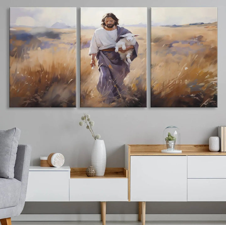 Introducing the Jesus the Good Shepherd Wall Art Canvas Print - Lost Lamb: a captivating triptych depicting a robed man holding a lamb in a radiant golden field. This elegant piece is perfect for adding a touch of traditional Christian decor to your living space, seamlessly blending faith with contemporary style.