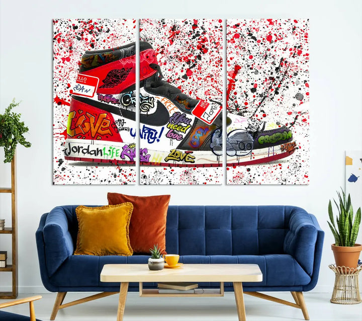 A large triptych mural titled "Jordan Shoes Graffiti Wall Art Canvas Print - Jordan Graffiti Canvas Wall Art" features images of Jordan Shoes against a splattered paint background that resembles graffiti, making it an ideal choice for sneakerheads and urban art lovers.