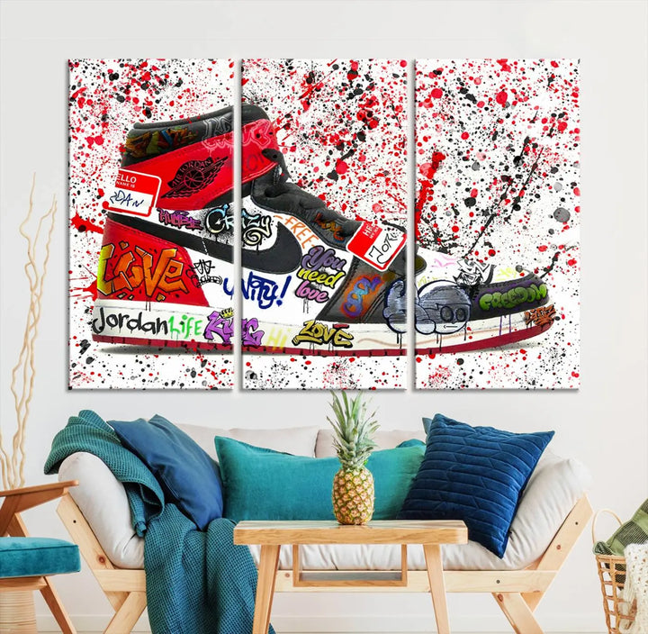 A large triptych mural titled "Jordan Shoes Graffiti Wall Art Canvas Print - Jordan Graffiti Canvas Wall Art" features images of Jordan Shoes against a splattered paint background that resembles graffiti, making it an ideal choice for sneakerheads and urban art lovers.