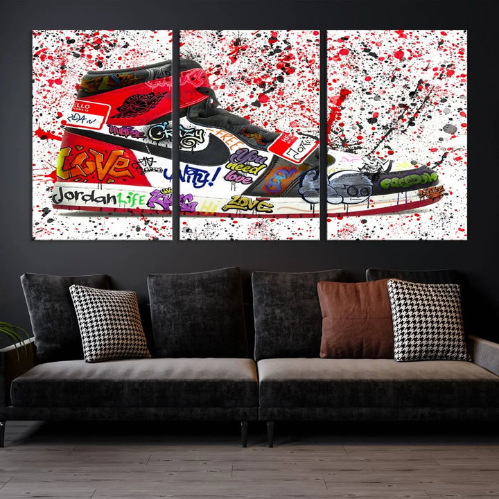 A large triptych mural titled "Jordan Shoes Graffiti Wall Art Canvas Print - Jordan Graffiti Canvas Wall Art" features images of Jordan Shoes against a splattered paint background that resembles graffiti, making it an ideal choice for sneakerheads and urban art lovers.