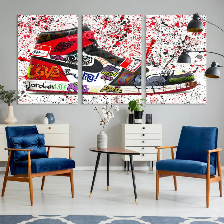 A large triptych mural titled "Jordan Shoes Graffiti Wall Art Canvas Print - Jordan Graffiti Canvas Wall Art" features images of Jordan Shoes against a splattered paint background that resembles graffiti, making it an ideal choice for sneakerheads and urban art lovers.