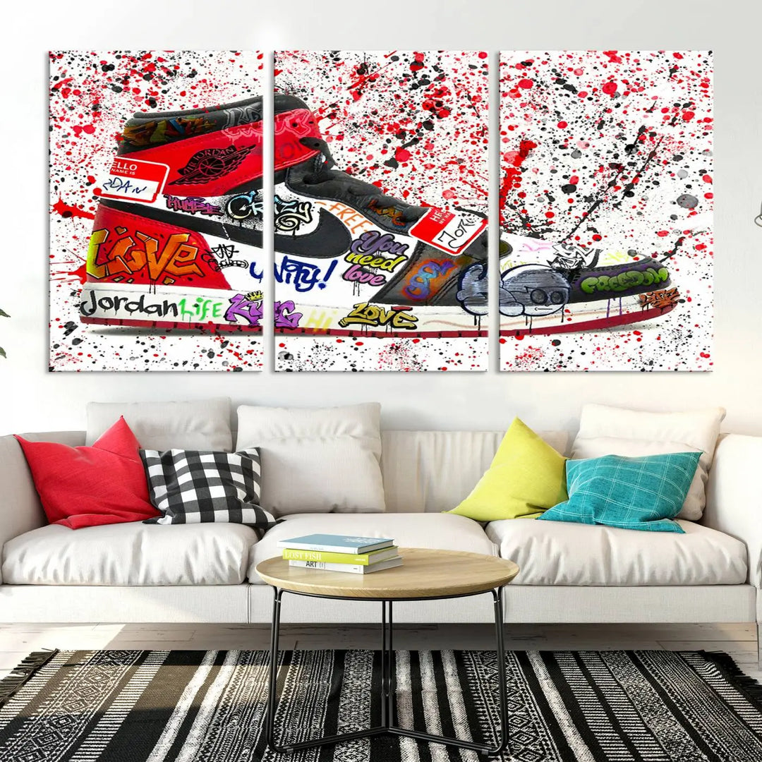 A large triptych mural titled "Jordan Shoes Graffiti Wall Art Canvas Print - Jordan Graffiti Canvas Wall Art" features images of Jordan Shoes against a splattered paint background that resembles graffiti, making it an ideal choice for sneakerheads and urban art lovers.