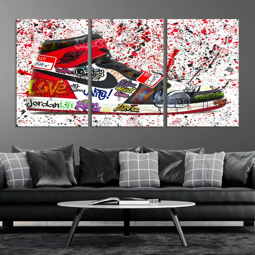 A large triptych mural titled "Jordan Shoes Graffiti Wall Art Canvas Print - Jordan Graffiti Canvas Wall Art" features images of Jordan Shoes against a splattered paint background that resembles graffiti, making it an ideal choice for sneakerheads and urban art lovers.