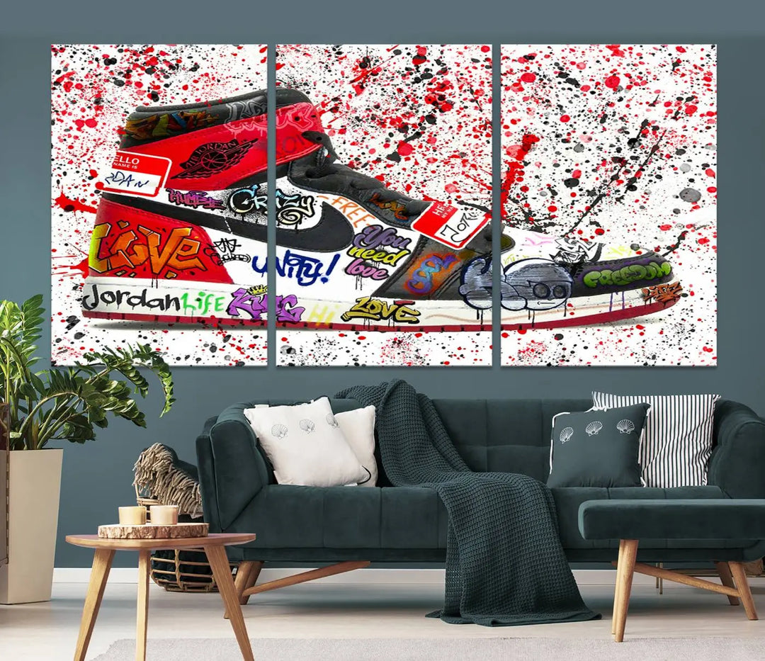 A large triptych mural titled "Jordan Shoes Graffiti Wall Art Canvas Print - Jordan Graffiti Canvas Wall Art" features images of Jordan Shoes against a splattered paint background that resembles graffiti, making it an ideal choice for sneakerheads and urban art lovers.