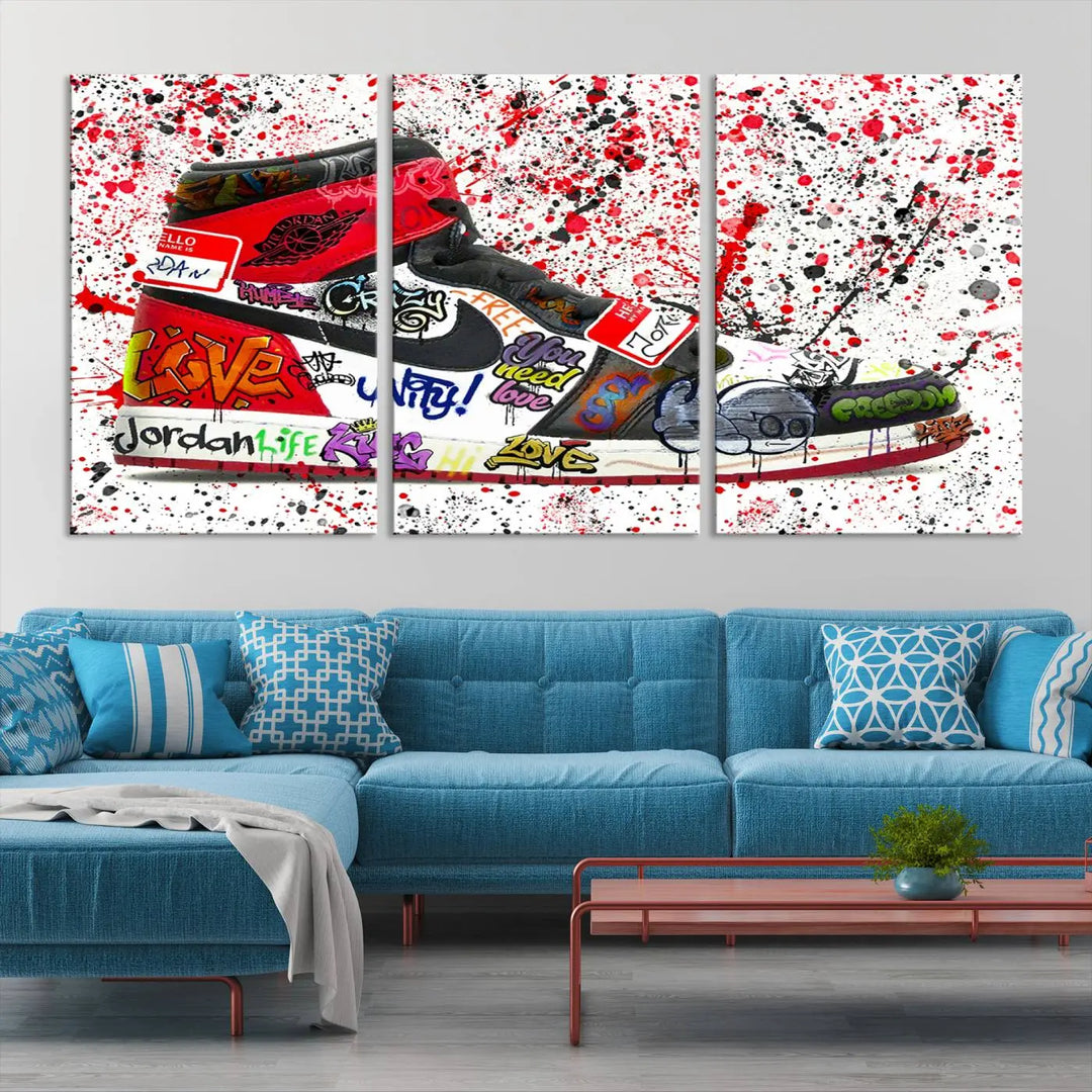 A large triptych mural titled "Jordan Shoes Graffiti Wall Art Canvas Print - Jordan Graffiti Canvas Wall Art" features images of Jordan Shoes against a splattered paint background that resembles graffiti, making it an ideal choice for sneakerheads and urban art lovers.