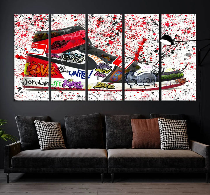 A large triptych mural titled "Jordan Shoes Graffiti Wall Art Canvas Print - Jordan Graffiti Canvas Wall Art" features images of Jordan Shoes against a splattered paint background that resembles graffiti, making it an ideal choice for sneakerheads and urban art lovers.