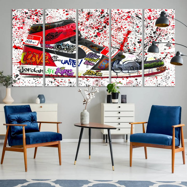 A large triptych mural titled "Jordan Shoes Graffiti Wall Art Canvas Print - Jordan Graffiti Canvas Wall Art" features images of Jordan Shoes against a splattered paint background that resembles graffiti, making it an ideal choice for sneakerheads and urban art lovers.