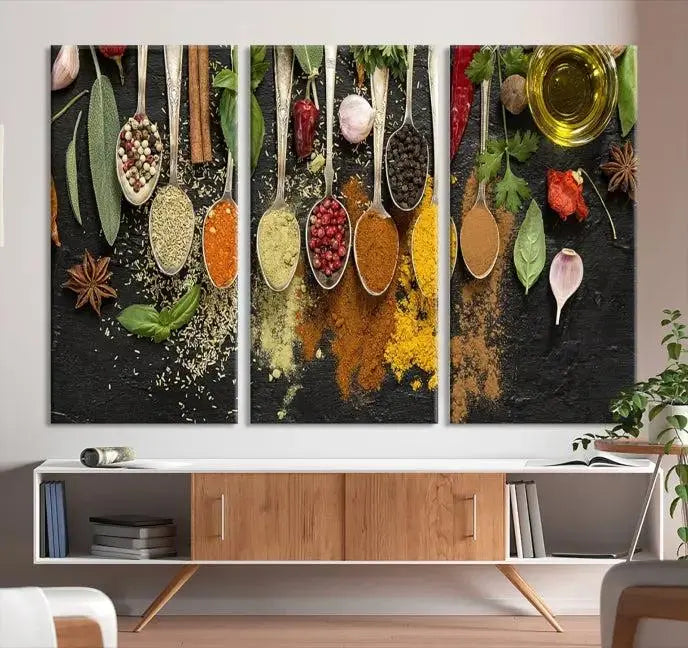 The Kitchen Spice Wall Art Canvas Print is a triptych set, gallery wrapped for sophistication, featuring various spices and herbs on spoons. Made with museum-quality polycotton and completed with a UV-protective coating, it ensures enduring vibrancy and allure.