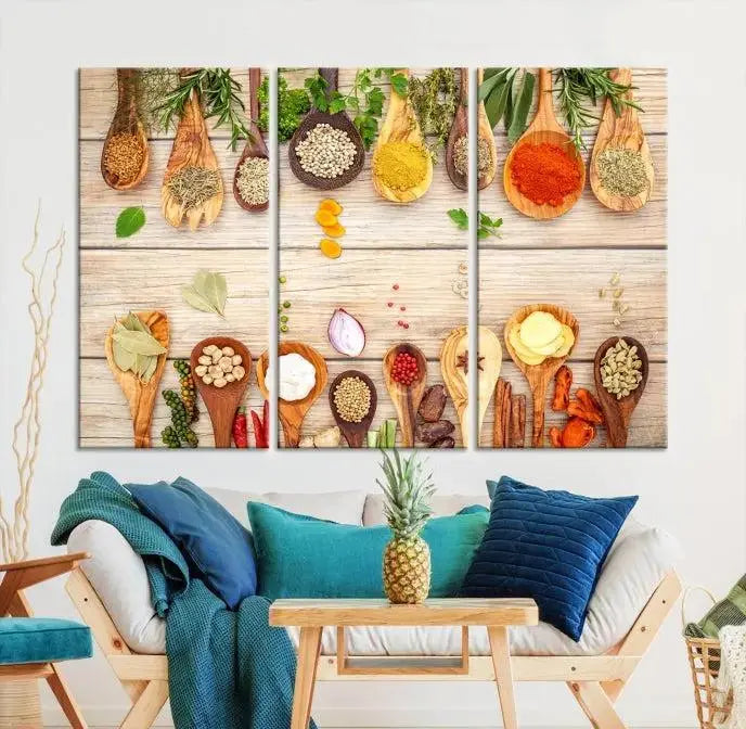 The Kitchen Spice on the Table Wall Art Canvas Print features a triptych of wooden spoons with an array of spices and herbs, artfully presented on a wooden background. Printed on museum-quality canvas, it guarantees lasting elegance and durability.