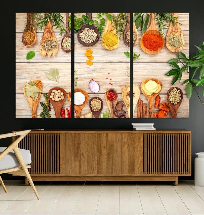 The Kitchen Spice on the Table Wall Art Canvas Print features a triptych of wooden spoons with an array of spices and herbs, artfully presented on a wooden background. Printed on museum-quality canvas, it guarantees lasting elegance and durability.