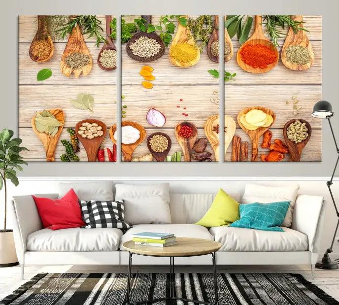 The Kitchen Spice on the Table Wall Art Canvas Print features a triptych of wooden spoons with an array of spices and herbs, artfully presented on a wooden background. Printed on museum-quality canvas, it guarantees lasting elegance and durability.