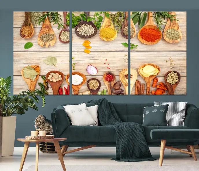 The Kitchen Spice on the Table Wall Art Canvas Print features a triptych of wooden spoons with an array of spices and herbs, artfully presented on a wooden background. Printed on museum-quality canvas, it guarantees lasting elegance and durability.