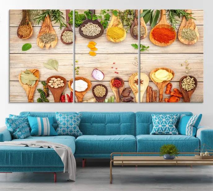 The Kitchen Spice on the Table Wall Art Canvas Print features a triptych of wooden spoons with an array of spices and herbs, artfully presented on a wooden background. Printed on museum-quality canvas, it guarantees lasting elegance and durability.