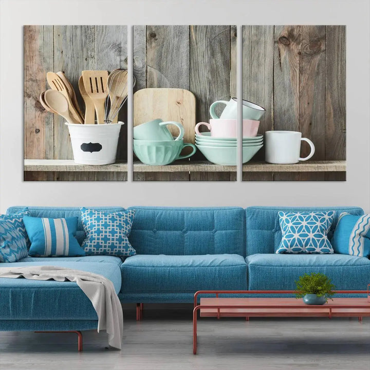 The "Kitchenware on Rustic Woods Canvas" features a triptych of kitchen utensils and cups. This piece evokes artistry reminiscent of museum-quality canvases, with each detail appearing as if handcrafted in the USA.