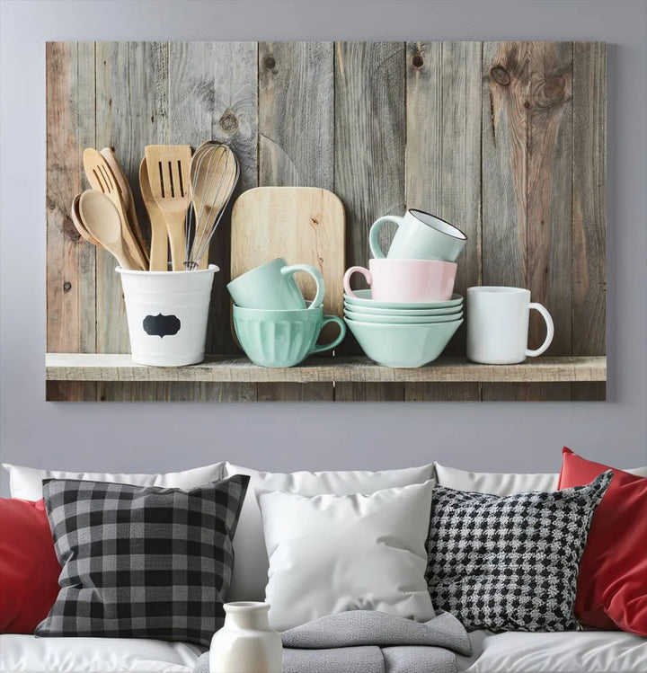 The "Kitchenware on Rustic Woods Canvas" features a triptych of kitchen utensils and cups. This piece evokes artistry reminiscent of museum-quality canvases, with each detail appearing as if handcrafted in the USA.