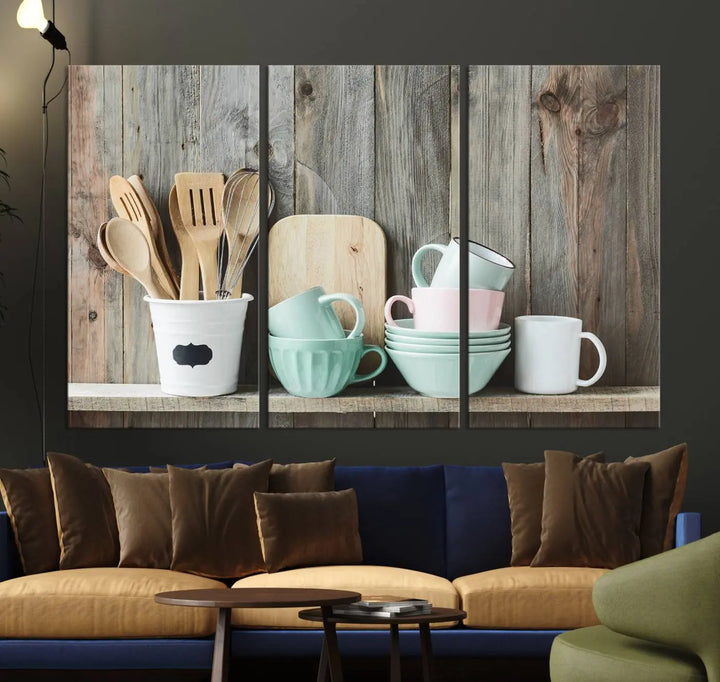 The "Kitchenware on Rustic Woods Canvas" features a triptych of kitchen utensils and cups. This piece evokes artistry reminiscent of museum-quality canvases, with each detail appearing as if handcrafted in the USA.