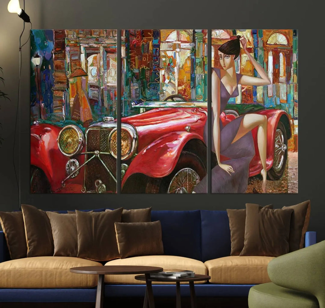 The modern living room is adorned with the "Lady With a Red Antique Car Wall Art Canvas Print," a triptych featuring a vintage red car and woman. This museum-quality canvas is ready to hang with a UV-protective coating to ensure lasting vibrancy.