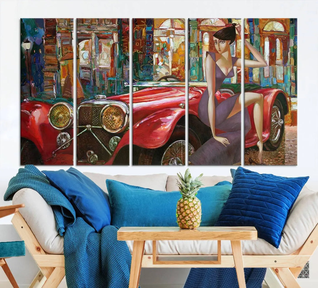 The modern living room is adorned with the "Lady With a Red Antique Car Wall Art Canvas Print," a triptych featuring a vintage red car and woman. This museum-quality canvas is ready to hang with a UV-protective coating to ensure lasting vibrancy.