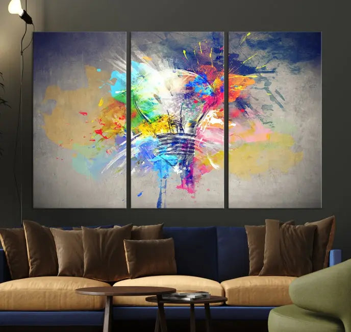 The Lamp Abstract Color Wall Art Canvas Print showcases vibrant splashes of color around a light bulb design. This museum-quality canvas comes ready to hang and features a UV-protective coating to keep its colors vivid and striking for years.