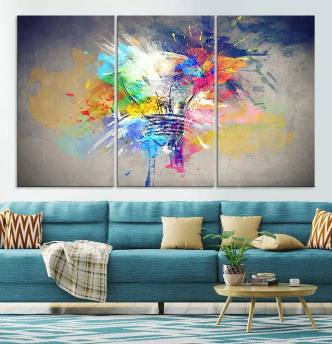 The Lamp Abstract Color Wall Art Canvas Print showcases vibrant splashes of color around a light bulb design. This museum-quality canvas comes ready to hang and features a UV-protective coating to keep its colors vivid and striking for years.