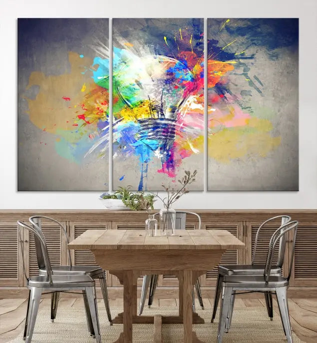 The Lamp Abstract Color Wall Art Canvas Print showcases vibrant splashes of color around a light bulb design. This museum-quality canvas comes ready to hang and features a UV-protective coating to keep its colors vivid and striking for years.