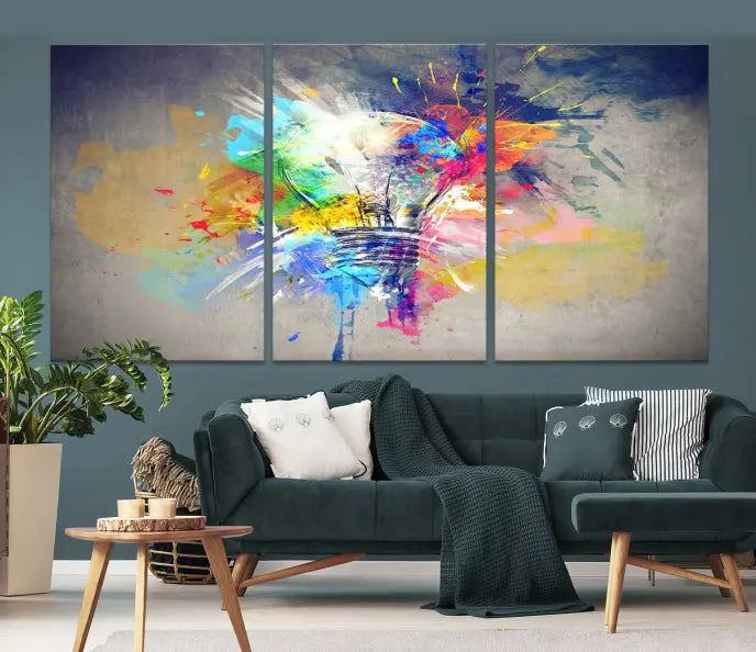 The Lamp Abstract Color Wall Art Canvas Print showcases vibrant splashes of color around a light bulb design. This museum-quality canvas comes ready to hang and features a UV-protective coating to keep its colors vivid and striking for years.