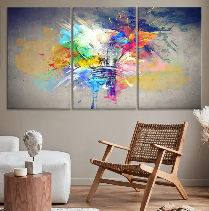 The Lamp Abstract Color Wall Art Canvas Print showcases vibrant splashes of color around a light bulb design. This museum-quality canvas comes ready to hang and features a UV-protective coating to keep its colors vivid and striking for years.