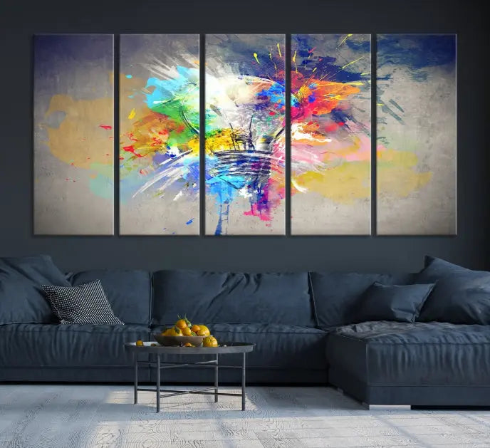 The Lamp Abstract Color Wall Art Canvas Print showcases vibrant splashes of color around a light bulb design. This museum-quality canvas comes ready to hang and features a UV-protective coating to keep its colors vivid and striking for years.