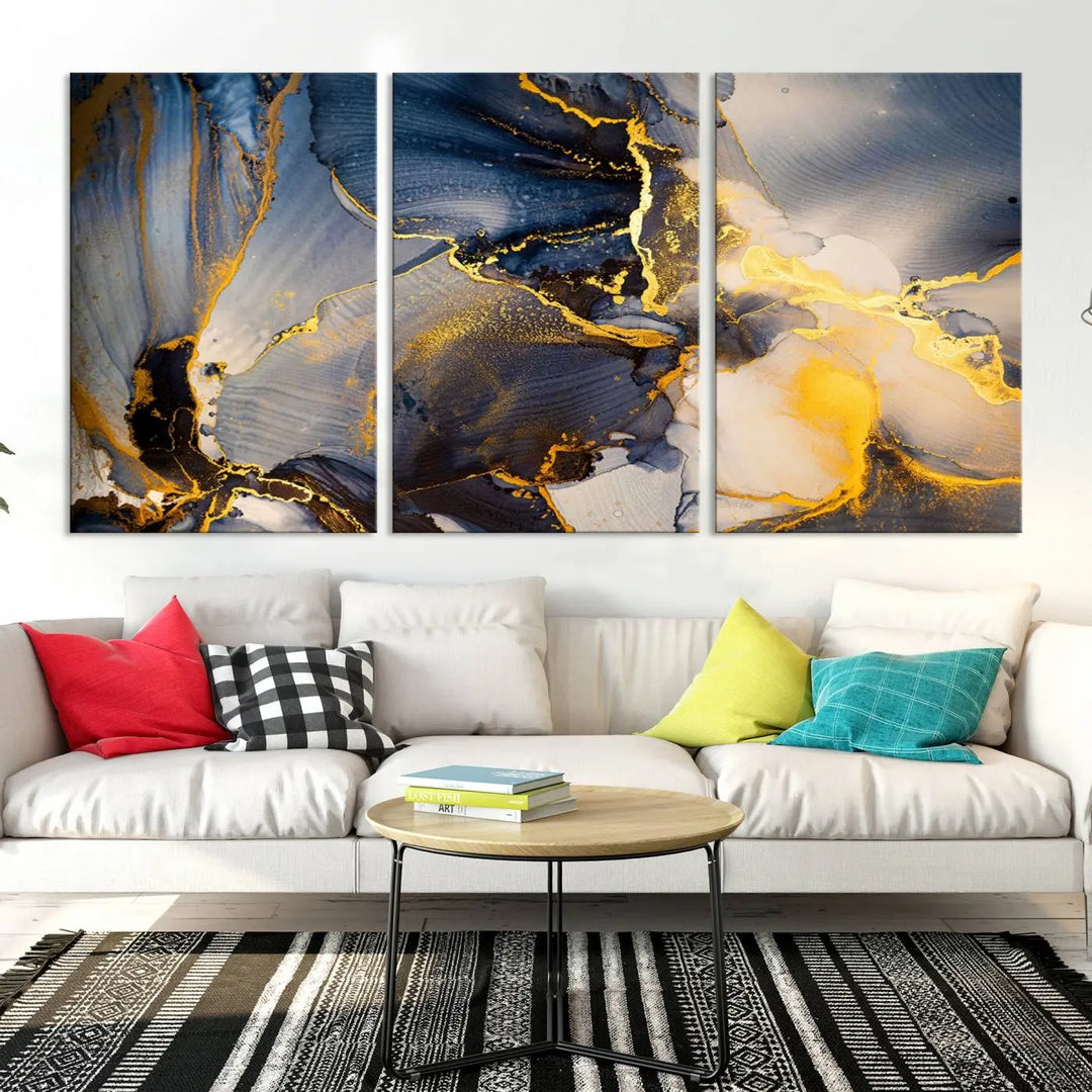 A captivating Large Abstract Wall Art Print - Gold and Blue Abstract Canvas, featuring fluid ink designs, elegantly hangs as the focal point of the room.