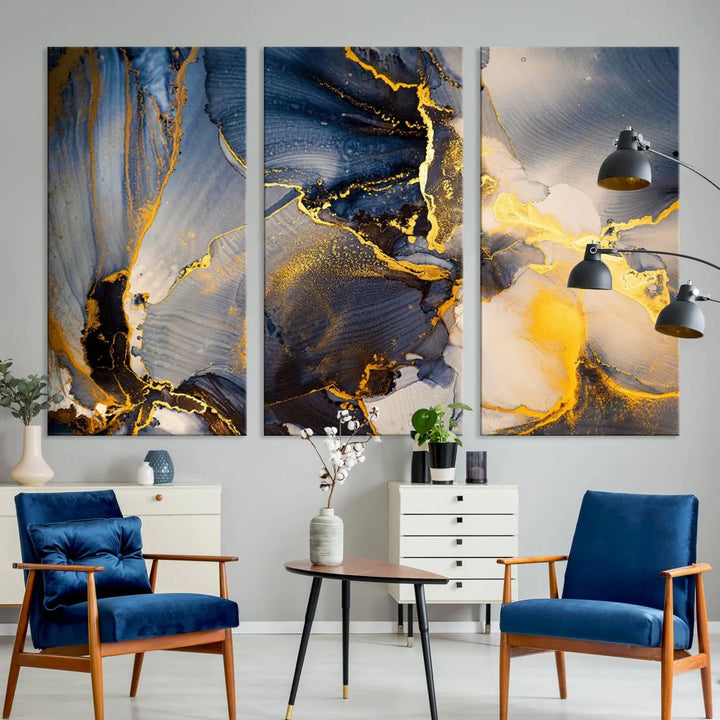 A captivating Large Abstract Wall Art Print - Gold and Blue Abstract Canvas, featuring fluid ink designs, elegantly hangs as the focal point of the room.