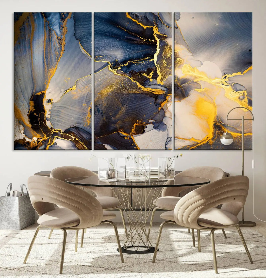 A captivating Large Abstract Wall Art Print - Gold and Blue Abstract Canvas, featuring fluid ink designs, elegantly hangs as the focal point of the room.