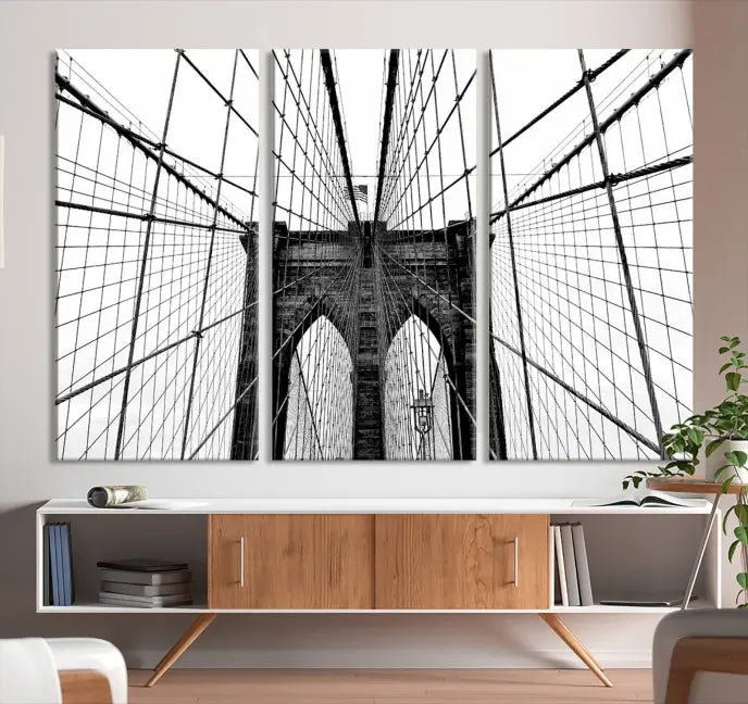 The Large Brooklyn Bridge Wall Art Canvas Print, a black and white photograph of a bridge, is elegantly displayed in two panels. The artwork is printed on museum-quality canvases.