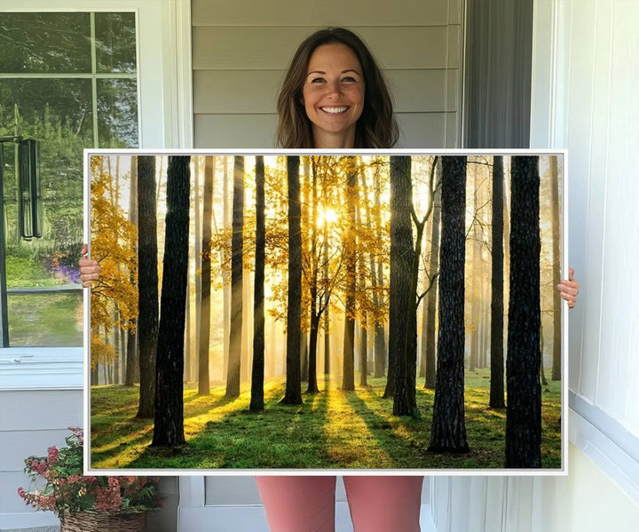 A large wall art landscape canvas print of tall trees at sunset.